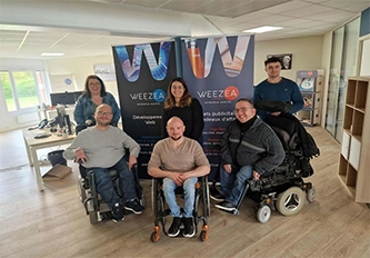 a group of people sitting in wheelchairs in a room